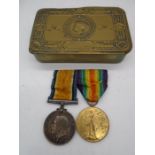 A Queen Mary Christmas 1914 tin with two WWI medals awarded to 79817, A. Sgt V. A. Allemande,