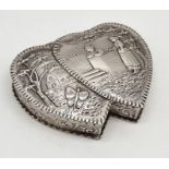 A hallmarked silver double entwined heart box with Dutch style scene. Inscription to reverse dated