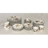 A Johnson Brothers part dinner service with floral and fruit pattern including dinner plates, bowls,