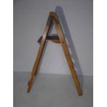 A vintage wooden step ladder