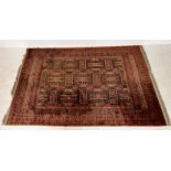 A large Eastern red ground rug 250cm x 170cm