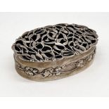 A hallmarked silver oval lidded box/potpourri decorated with mistletoe, William Comyns, London 1908