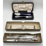 A hallmarked silver Christening set along with a set of silver handled knives