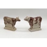 A Rye Pottery Cow and Bull pair with raised lettering 17.5cm x 19.5cm