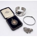Two silver bracelets, silver medallion and a brooch in the form of a feather, total weight 42g