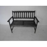 A weathered wooden garden bench, length 118cm.