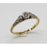 An 18ct gold and platinum ring set with a diamond, weight 2g