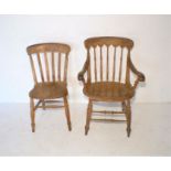 An elm spindle back carver chair, along with an elm country chair.