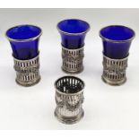 Three hallmarked silver and blue glass goblets along with one further silver sleeve
