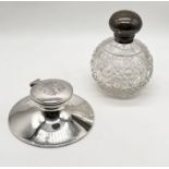 A hallmarked silver inkwell along with a silver topped scent bottle (scent bottle hinge A/F)