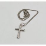 A 9ct white gold cross on chain, total weight 1.1g