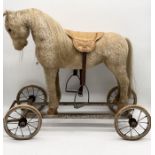 A Panurge 1920's/30's pull-a-long mohair horse on wheels with real horse hair mane and tail, leather