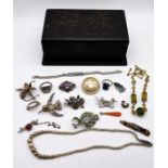 A collection of cotume jewellery including silver, gold coloured mourning brooch (A/F) etc.