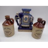 An Oriental pottery elephant (24.5cm height) along with two Perry Bros. cider jars