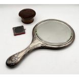 A hallmarked silver mirror along with a miniature silver photo frame etc