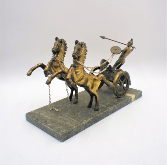 A brass figure of a Roman chariot, on marble base, A/F.