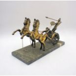 A brass figure of a Roman chariot, on marble base, A/F.