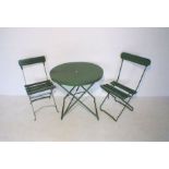 A green painted folding garden bistro set, comprising of a table and two chairs.