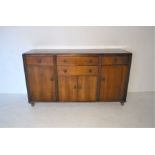 An Edwardian sideboard, with four drawers and cupboards under, length 172cm, depth 54cm, height