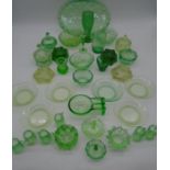 A collection of Uranium and other green glassware