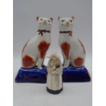 A pair of 19th century Staffordshire cats, height 18cm along with a Royal Worcester candle snuffer