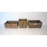 Two wooden ammo crates, along with one other smaller.
