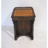 A turn of the century rosewood davenport, with barley twist supports - one caster missing on back,