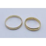 An 18ct gold wedding band (2.8g) along with a 9ct band (1.9g)
