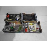 Four boxes of various OO gauge model railway accessories including carriages, rolling stock,