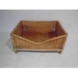 A wicker dog basket - length 100cm