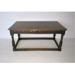A part 17th century oak table with two frieze drawers and carved detailing, length 150cm, width