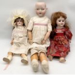 Three antique bisque headed dolls one marked for Armand Marseille
