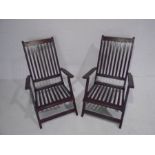 Two folding teak garden chairs