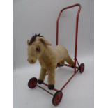 A vintage Chiltern Toys push along horse - length approx. 45cm