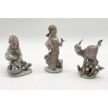Three Lladro figurines including Joy in a Basket, Spring Girl and "Hi There" fawn