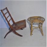 A turn of the century campaign chair plus a stool