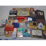 A collection of vintage games including chess, draughts, playing cards, bag of marbles, diabolo,