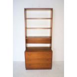 A mid-century bookshelf with three drawers under, length 76cm, height 172cm.