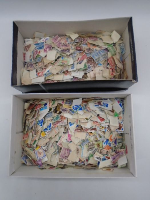Two shoe boxes of loose stamps