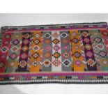 A flat woven Kilim style rug. 290cm x 153cm A/F