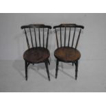 A pair of elm penny seated stick-back dining chairs
