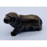 A miniature bronze figure of a dog