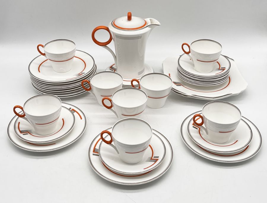 A Shelley Art Deco part tea set comprising of 8 teacups, 11 saucers, 12 side plates, 2 sandwich