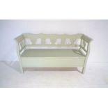 A painted bench with lift up seat, length 168cm, height 91cm.