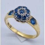 An 18ct gold sapphire cluster ring
