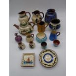 A collection of mainly Torquay Ware studio pottery including a Clovelly tea pot, jugs, egg cups,
