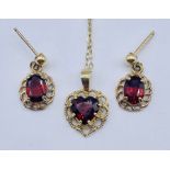 A 9ct gold and garnet set of earrings and pendant on fine chain