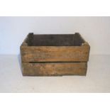 A vintage wooden apple crate marked 'Tardebigge Orchards'.