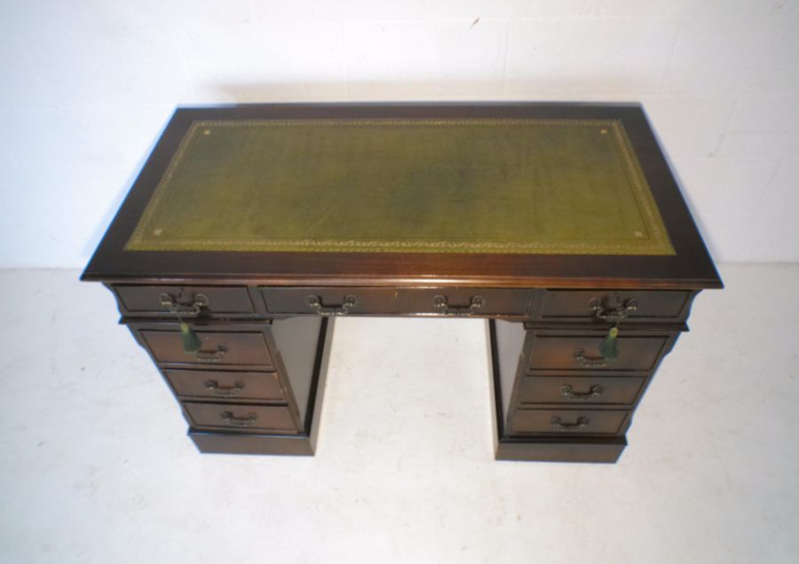 A reproduction mahogany kneehole desk, with green leather inset top, length 121cm, depth 61cm, - Image 2 of 6