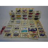 A collection of mainly boxed Lledo Days Gone die cast vehicles including vans, buses, trucks etc,